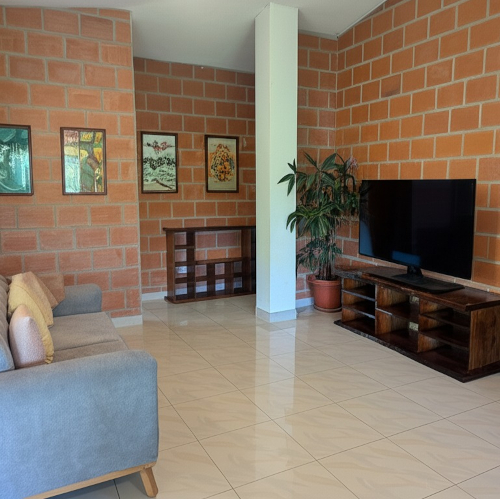 Living room area with sofa and chairs